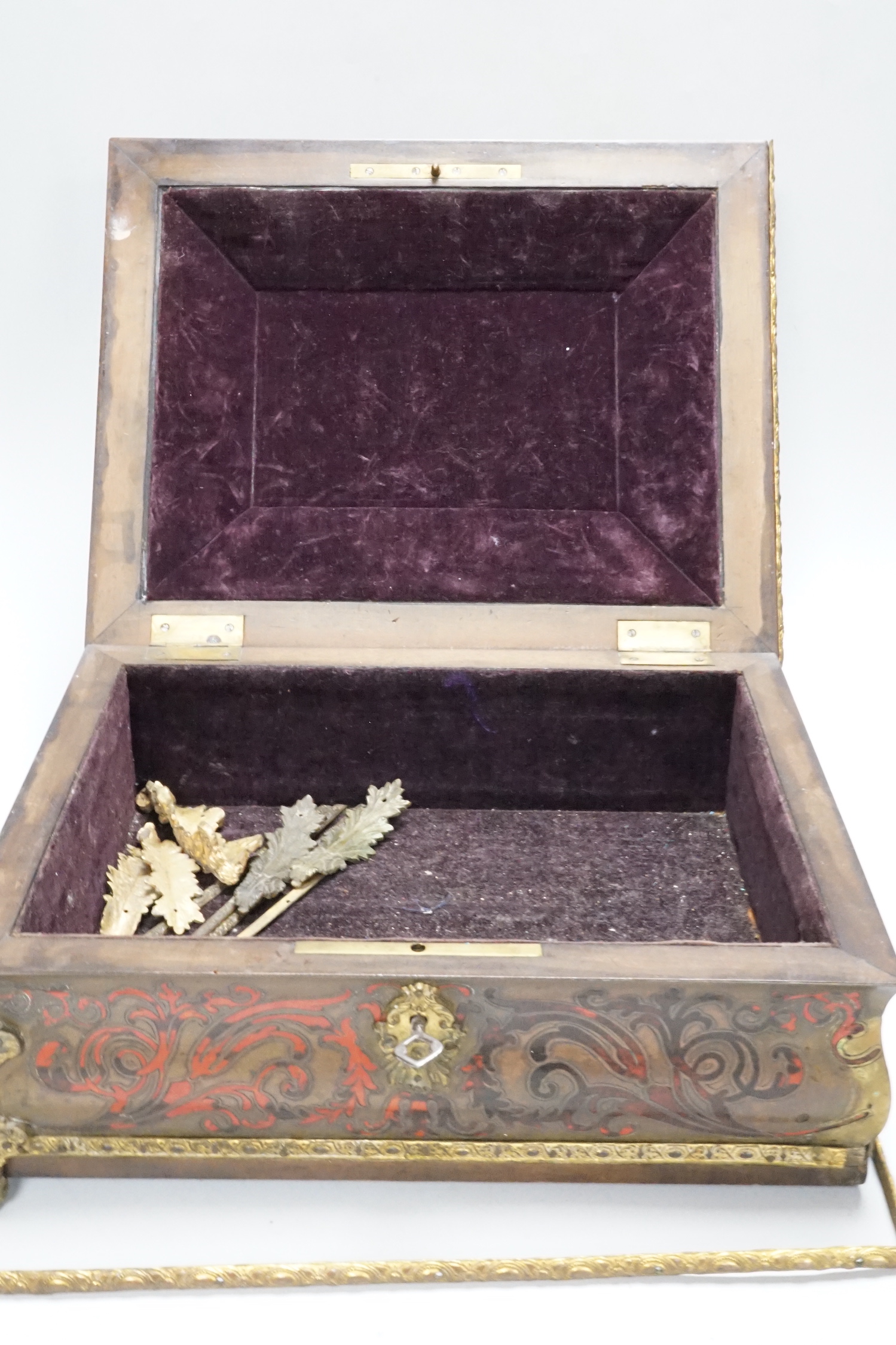 A 19th century French scarlet boulle and tortoiseshell box, 32cm wide, 25cm deep (a.f.)